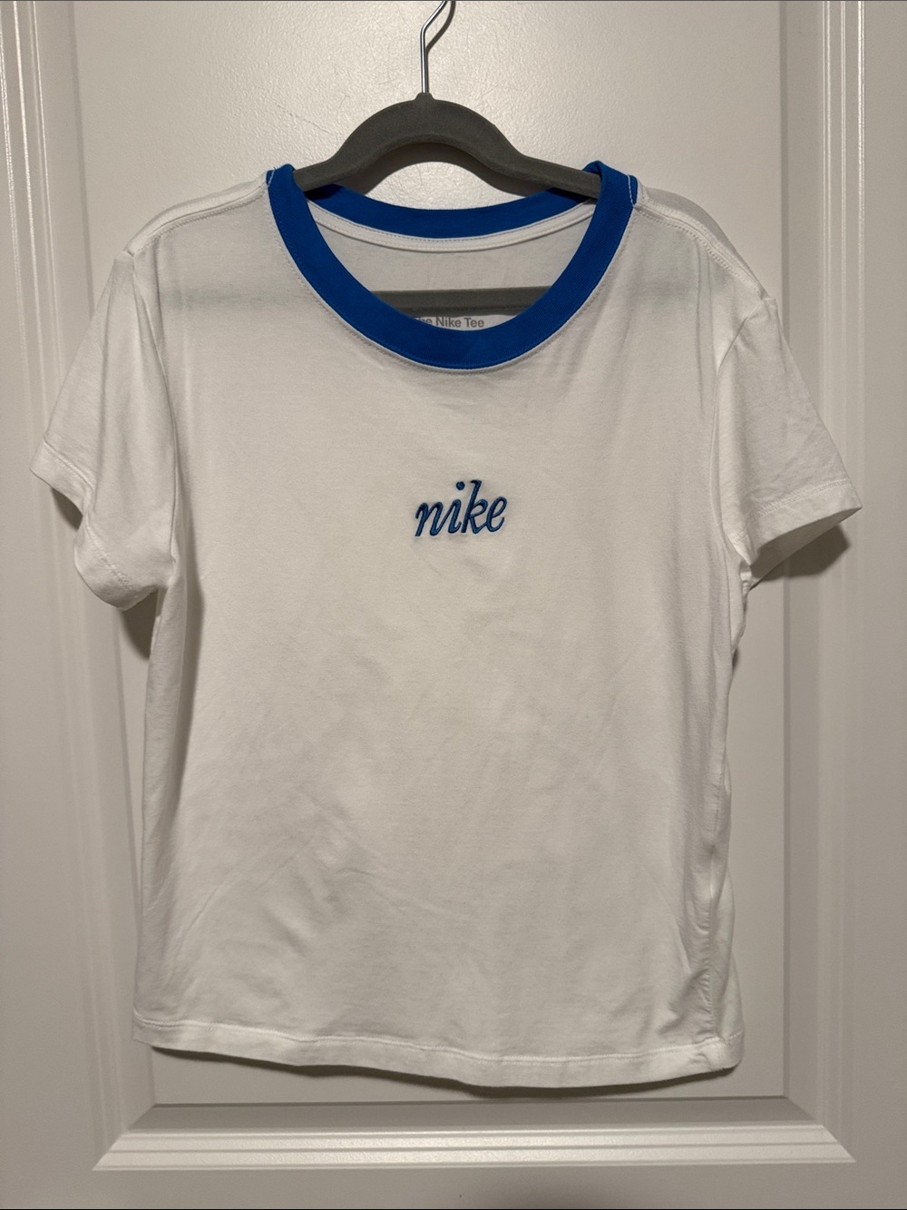 Nike White Tee with Blue Ribbed Neckline and Script Logo